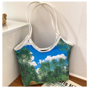 Artistic oil painting canvas tote bag on wooden surface with scenic landscape print