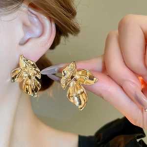 Polished gold metal leaf earrings with pleated texture and geometric design for women