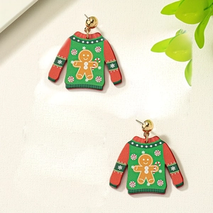 Boucles d'oreilles pull de Noël moche avec bonhomme en pain d'épices sur fond blanc