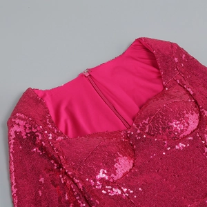 Close-up of fuchsia sequin party dress showing sweetheart neckline and back zipper detail