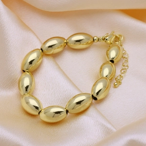 18k gold plated copper bracelet with smooth oval olive beads and lobster clasp