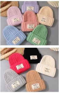 Detailed knit texture and vintage fabric patch on colorful rabbit hair blend beanies