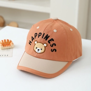 Close-up of bear embroidery and happiness text on a two-tone cotton baseball cap