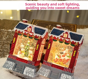 Detailed view of LED Christmas house lanterns with snowman and Santa Claus scenes