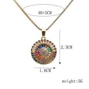 Detail of gold evil eye necklace with dimensions 40+5cm chain and 2.3cm pendant height