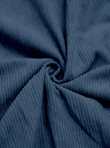 Detailed macro view of navy blue corduroy fabric showing soft vertical ribbed texture