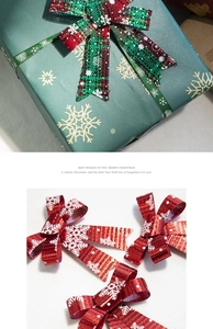 Close-up of red plaid and snowflake Christmas bows on a green gift box for DIY decor