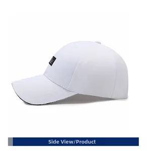 Side view of white cotton baseball cap showing neat stitching and small black rectangular label