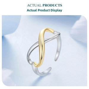 Detail of s925 silver adjustable ring featuring a two-tone infinity symbol design
