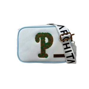 Minimalist light blue crossbody bag with plush green letter P and wide printed strap