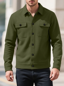 Detail of olive green waffle texture jacket with dual chest pockets and black buttons