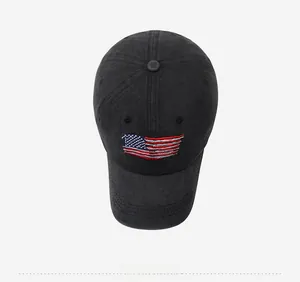 Detailed top view of a washed black cotton baseball cap with USA flag embroidery