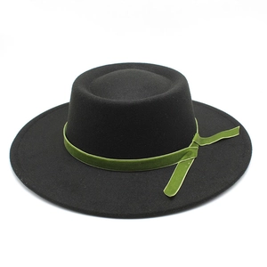 Detail of wool felt boater hat with olive green velvet ribbon and hanging tie