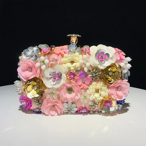 Detailed macro of 3D floral beaded evening bag with luxury satin and gemstone clasp