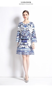 Detailed view of the blue and white porcelain floral print on a flare sleeve dress