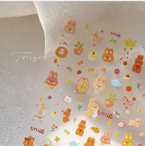 Dettaglio degli adesivi per unghie TS-3874 con graziosi conigli colorati e scritte smile