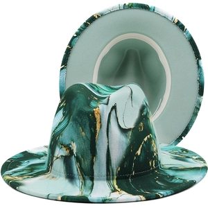 Unisex wool fedora hat with green and gold abstract marble print on a white background