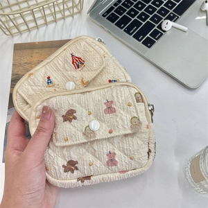 Quilted floral coin purse set featuring circus and teddy bear designs in cream white