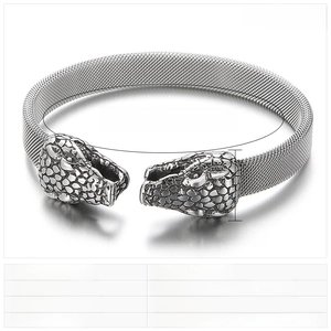 Detail of snake head carving on vintage stainless steel mesh chain bracelet for men