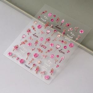 Detail of embossed pink rose and love letter nail stickers with metallic textures