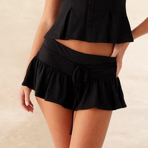 Women's black two-piece summer set with button-up crop top and ruffled mini skirt