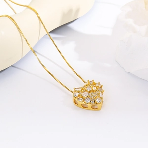 Detailed macro view of gold heart pendant necklace with shimmering white zircon stones