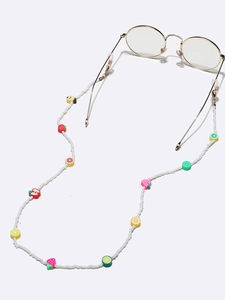 White beaded eyeglass chain with colorful fruit charms and gold metal hooks