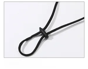 Detail of adjustable black windproof chin strap with plastic toggle for outdoor hats