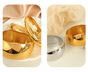 Polished titanium steel bangles in wide and narrow styles with gold and silver finishes