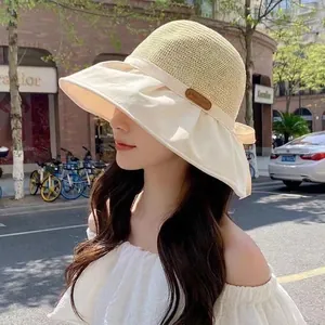 Women's wide brim sun hat with breathable straw top and elegant side bow detail