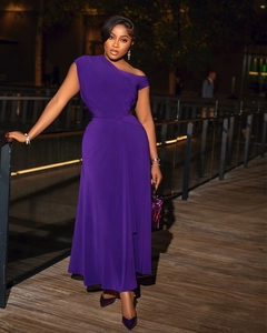 Detail of off-shoulder pleated neckline on a slim fit deep purple evening maxi dress