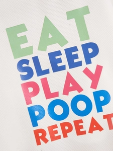 Detailed view of colorful Eat Sleep Play Poop Repeat text print on white mesh fabric