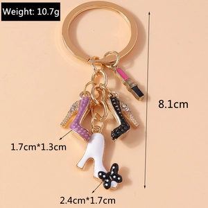Detail view of stylish lipstick and high heel charms keychain with size dimensions