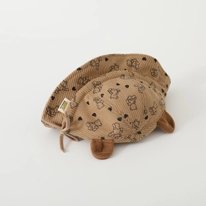 Detailed view of baby bear fisherman hat with soft corduroy texture and bear prints