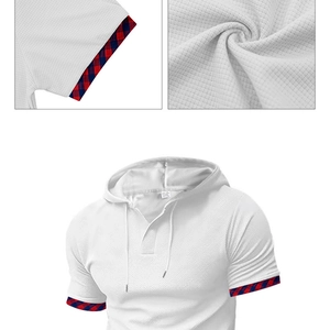 Detail of white waffle texture hoodie showing red and blue plaid cuffs and V-neck design
