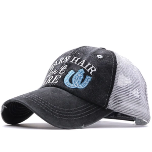 Distressed ponytail baseball cap with mesh back and Barn Hair Don't Care embroidery