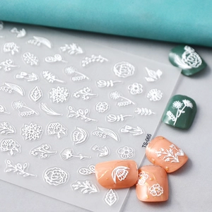 Macro detail of TS-065 white 3D embossed nail stickers with flower and leaf patterns