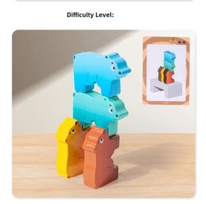 Macro shot of stacking wooden bear blocks and challenge card for child logic development