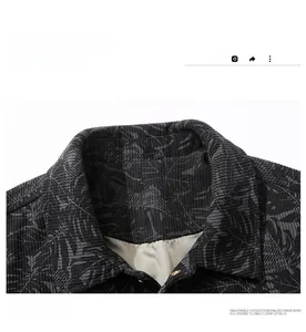 Macro shot of dark grey corduroy jacket collar with tropical leaf print and smooth lining