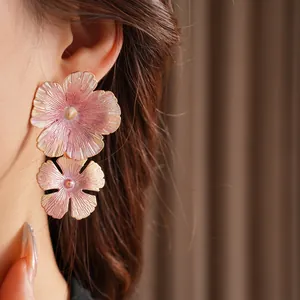 Elegant vintage enamel flower earrings in pink purple and gold for a luxury look
