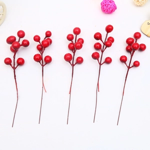 Detailed view of 5 vibrant red artificial berry picks for Christmas tree decoration