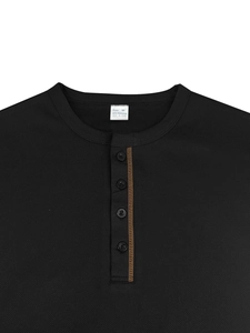Detail view of the button placket and texture on black men's polyester polo shirt