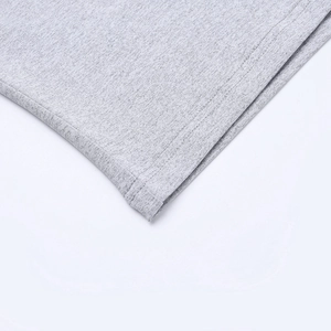 Macro shot of heather grey knit fabric texture with precision double-needle stitching hem