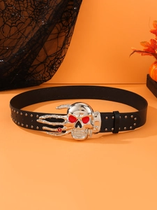 Macro view of punk leather belt with silver skull buckle and metal rivet details