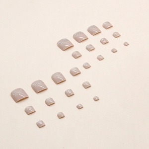 Sparkling pink gradient press-on toenails with silver glitter accents on 24 piece set