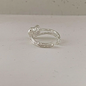 Detail of S925 sterling silver open ring featuring hammered texture and artistic heart design