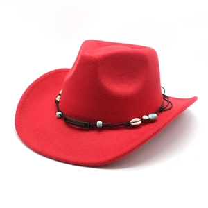 Detail of red wool felt cowboy hat with beaded band and shell ornaments