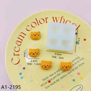 Detailed view of 4-cavity silicone mold with cat shaped resin crafts and dimensions