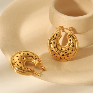Golden stainless steel hoop earrings with hollow moon and star patterns for women