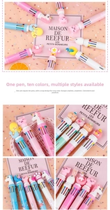Detail of 10-in-1 multi-color ballpoint pen with cute cartoon animal toppers